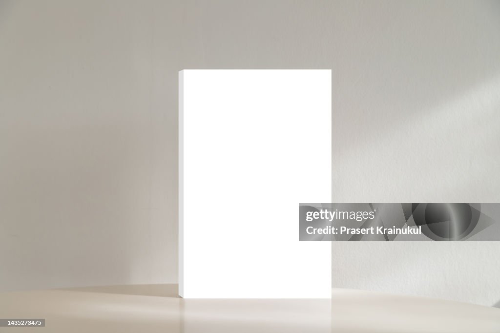 White rectangular box on table with concreate background