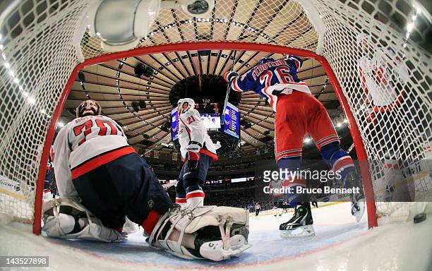 Ruslan Fedotenko celebrates a goal by teammate Artem Anisimov of the New York Rangers as Braden Holtby of the Washington Capitals reacts in the...