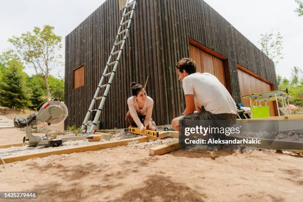 while working on a project in our yard - measuring wood stock pictures, royalty-free photos & images