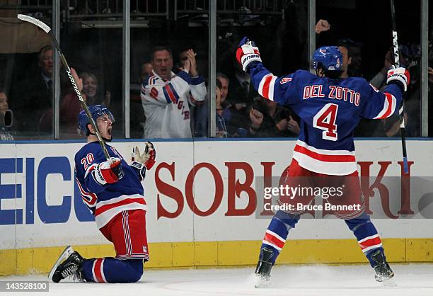 Chris Kreider celebrates his third period goal with teammate Michael Del Zotto of the New York Rangers in Game One of the Eastern Conference...