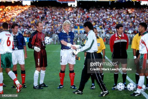 June 1998, Saint-Etienne - FIFA World Cup - Scotland v Morocco - Scotland captain Colin Hendry shakes hands with Morocco goalkeeper Driss Benzekri...