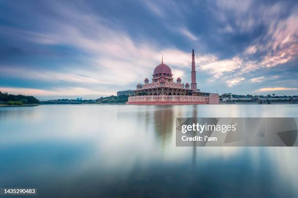 beautiful sunrise at putra mosque, putrajaya malaysia with colorful clouds and reflection on the lake surface - プトラジャヤ ストックフォトと画像