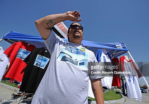 Residents sells shirts commemorating the Los Angeles riots at the intersection of Florence and Normandie Avenues on April 28, 2012 in Los Angeles,...