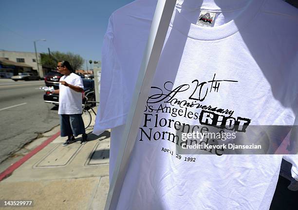 Residents sell shirts commemorating the Los Angeles riots at the intersection of Florence and Normandie Avenues on April 28, 2012 in Los Angeles,...