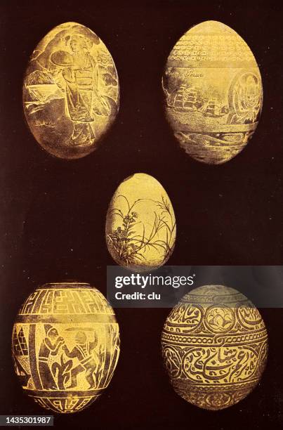 five golden easter eggs on black background - century egg stock illustrations
