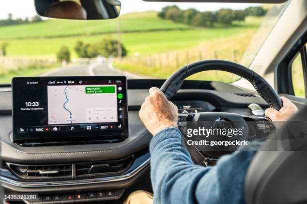 rural journey in an electric car - global positioning system stock pictures, royalty-free photos & images