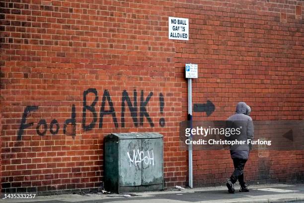Sign painted on the side of a house directs people to a local food bank on October 21, 2022 in Leeds, England. A report from the Office for National...