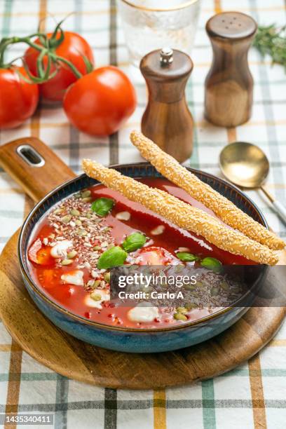 homemade tomato soup in a bowl - velouté stockfoto's en -beelden