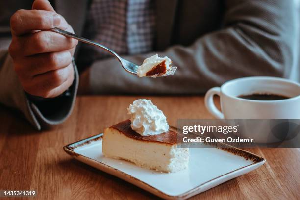 cream cheesecake and coffee served on the table, man eating cheesecake, - man eating pie stock pictures, royalty-free photos & images