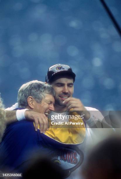 General Manager and Head Coach Dick Vermeil and Quarterback Kurt Warner of the St. Louis Rams celebrate winning Super Bowl XXXIV in the post game...