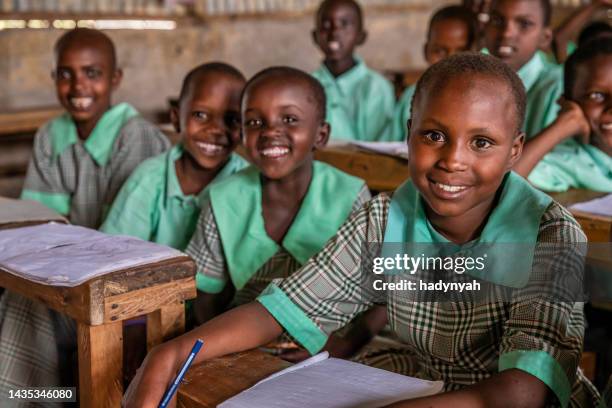 school children in a school near masai mara game reserve in kenya - native african girls 個照片及圖片檔