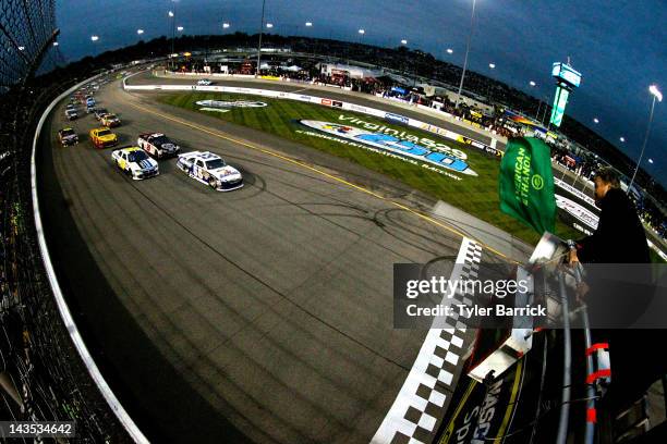 Mark Martin, driver of the Aaron's Dream Machine Toyota, and Carl Edwards, driver of the Roush Fenway Racing Ford, lead the field to the green flag...