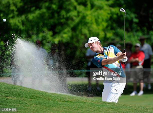 Jonas Blixt of Sweden hits from a bunker on the first hole during the third round of the Zurich Classic of New Orleans at TPC Louisiana on April 28,...