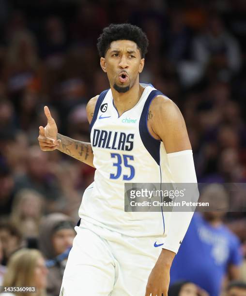 Christian Wood of the Dallas Mavericks reacts to a three-point shot against the Phoenix Suns during the second half of the NBA game at Footprint...