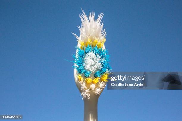 microplastics: old toothbrush blue background, worn toothbrush background with plastic bristles - change toothbrush stock pictures, royalty-free photos & images