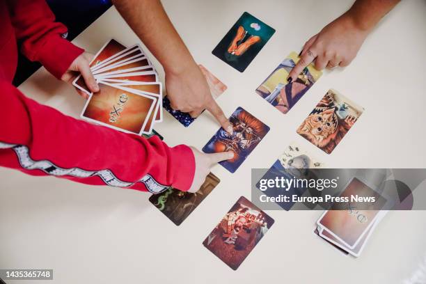 Child with the card game 'Dixit', at the ASAM Familia Foundation, on 21 October, 2022 in Madrid, Spain. The ASAM Foundation - Mental Health Services,...