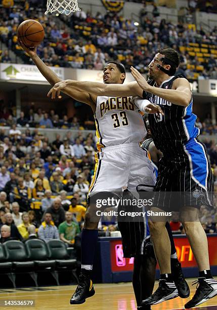 Danny Granger of the Indiana Pacers gets a shot off past Hedo Turkoglu of the Orlando Magic in Game One of the Eastern Conference Quarterfinals...