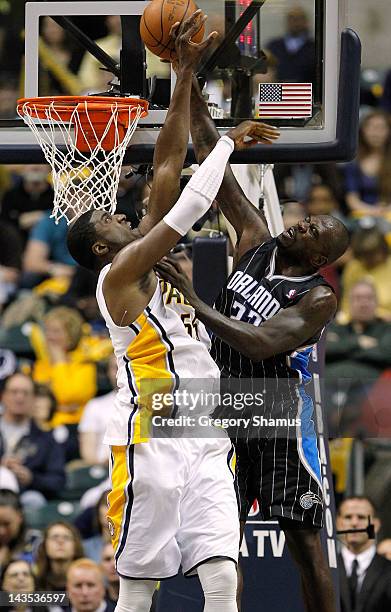 Ryan Anderson of the Orlando Magic tries to get to the rim for a dunk past Roy Hibbert of the Indiana Pacers in Game One of the Eastern Conference...
