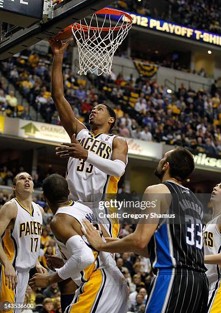 Danny Granger of the Indiana Pacers gets to the basket in front of Ryan Anderson of the Orlando Magic in Game One of the Eastern Conference...