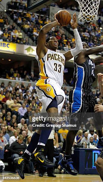 Danny Granger of the Indiana Pacers gets to the basket past Jason Richardson of the Orlando Magic in Game One of the Eastern Conference Quarterfinals...