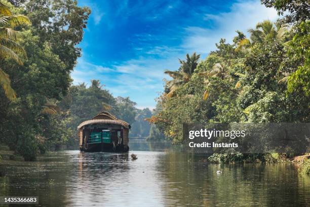 kerala backwaters houseboat trip - backwater stock pictures, royalty-free photos & images