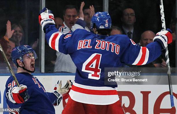 Chris Kreider celebrates his third period goal with teammate Michael Del Zotto of the New York Rangers in Game One of the Eastern Conference...