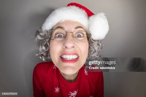 silly smiling mrs claus - mrs claus stock pictures, royalty-free photos & images