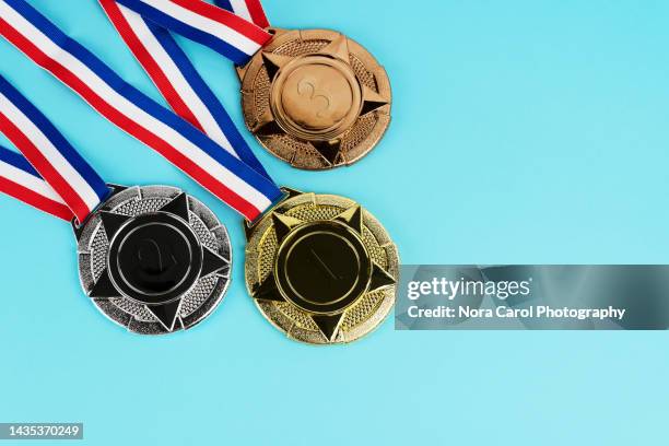 medals on blue background - medalist bildbanksfoton och bilder