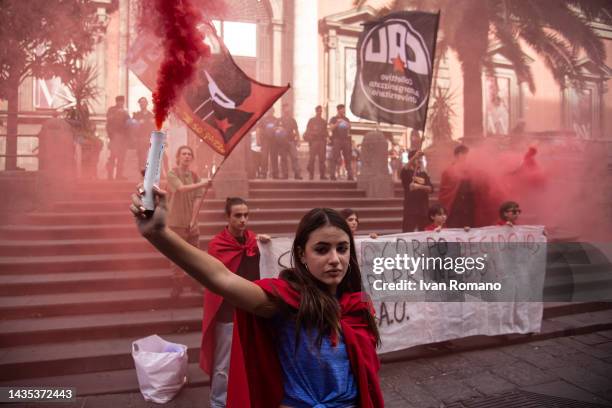 Girl with a smoke bomb demonstrates in defense of Law 194 and the right to abortion during an anti-fascist protest by students on October 21, 2022 in...