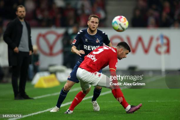 Benno Schmitz of 1. FC Koeln battles for possession with Aaron of 1. FSV Mainz 05 during the Bundesliga match between 1. FSV Mainz 05 and 1. FC Köln...