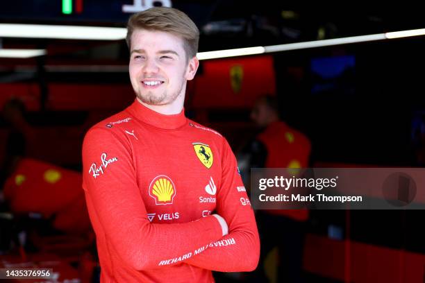 Robert Shwartzman of Israel and Ferrari looks on from the garage during practice ahead of the F1 Grand Prix of USA at Circuit of The Americas on...