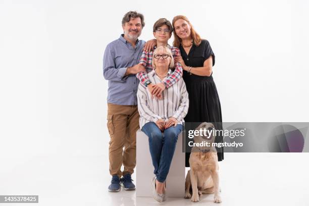 portrait of happy extended family together with their dog isolated on white background - multi generation family portrait stock pictures, royalty-free photos & images