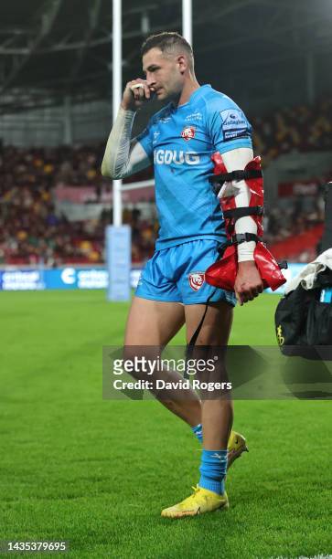 Jonny May of Gloucester walks off the pitch after injuring his left arm during the Gallagher Premiership Rugby match between London Irish and...
