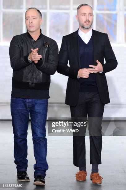 Fashion designers Steven Cox and Daniel Silver on the runway after their Duckie Brown fall 2013 menswear show at Industria Studios.