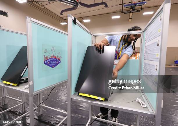 Clark County Election Department worker sets up a voting machine at a polling place at Desert Breeze Community Center on October 21, 2022 in Las...