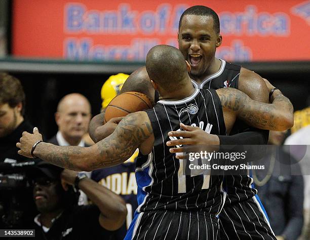 Glen Davis of the Orlando Magic celebrates a 81-77 victory over the Indiana Pacers with Jameer Nelson in Game One of the Eastern Conference...