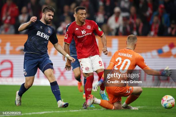 Karim Onisiwo of 1. FSV Mainz 05 scores their team's fifth goal past Marvin Schwaebe of 1. FC Koeln during the Bundesliga match between 1. FSV Mainz...