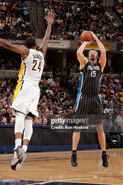Hedo Turkoglu of the Orlando Magic takes a jump shot against Paul George of the Indiana Pacers in Game One of the Eastern Conference Quarterfinals...