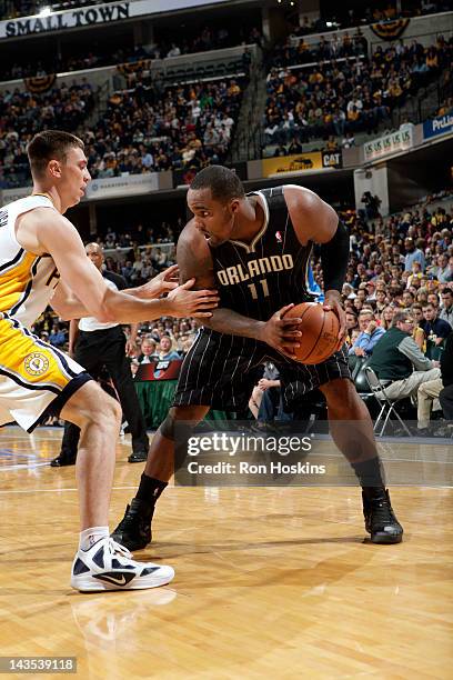 Glen Davis of the Orlando Magic looks to moves the ball against Tyler Hansbrough of the Indiana Pacers in Game One of the Eastern Conference...
