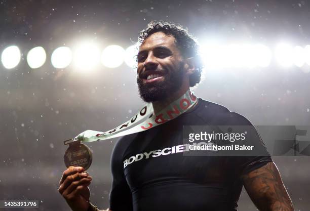 Josh Addo-Carr of Australia poses after being named Player of the Match following the Rugby League World Cup 2021 Pool B match between Australia and...