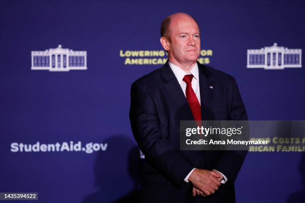 Sen. Chris Coons listens as Sen. Tom Carper speaks before U.S. President Joe Biden's remarks on student debt relief at Delaware State University on...