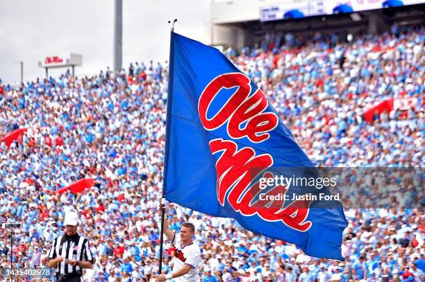 Mississippi Rebels cheerleader runs with a flag during the game against the Auburn Tigers at Vaught-Hemingway Stadium on October 15, 2022 in Oxford,...