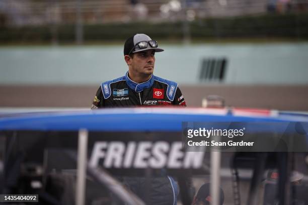 Stewart Friesen, driver of the Halmar International Toyota, stands on pit road during qualifying for the NASCAR Camping World Truck Series Baptist...