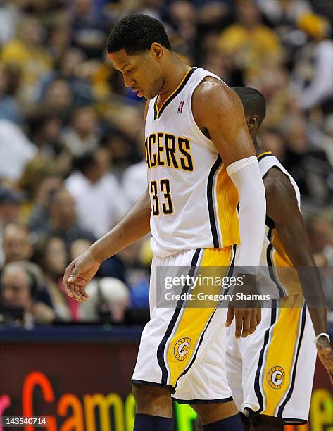 Danny Granger of the Indiana Pacers walks to the bench after missing a basket while playing the Orlando Magic in Game One of the Eastern Conference...