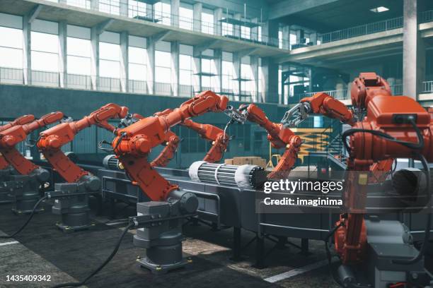 operai robot in fabbrica - manufacturing plant foto e immagini stock