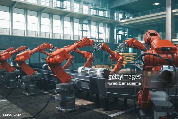 robot workers in factory - tillverka bildbanksfoton och bilder