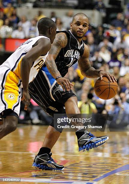Jameer Nelson of the Orlando Magic looks to get around the defense of Darren Collison of the Indiana Pacers in Game One of the Eastern Conference...
