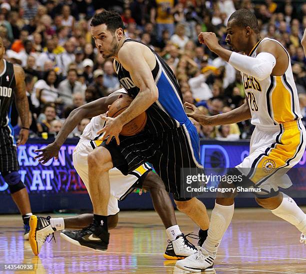 Redick of the Orlando Magic drives past the defense of Leandro Barbosa of the Indiana Pacers in Game One of the Eastern Conference Quarterfinals...