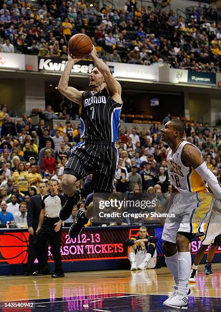 Redick of the Orlando Magic gets a shot off in front of Leandro Barbosa of the Indiana Pacers in Game One of the Eastern Conference Quarterfinals...