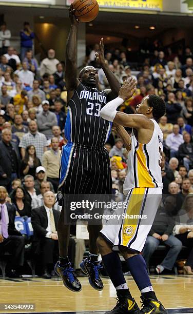 Jason Richardson of the Orlando Magic gets a shot off over Danny Granger of the Indiana Pacers in Game One of the Eastern Conference Quarterfinals...